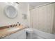 Updated bathroom featuring granite countertop, shower with tub, and tile flooring at 1438 Heritage Glen Dr, Marietta, GA 30068