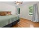 Cozy bedroom filled with natural light, featuring hardwood floors and neutral walls for a relaxing retreat at 1438 Heritage Glen Dr, Marietta, GA 30068