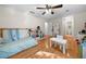 Bright bedroom with hardwood floors, ceiling fan, and playful decor at 1438 Heritage Glen Dr, Marietta, GA 30068
