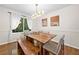 Cozy dining room with hardwood floors and a large window at 1438 Heritage Glen Dr, Marietta, GA 30068