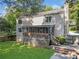 Back of the house featuring second story deck, fenced yard and patio at 1438 Heritage Glen Dr, Marietta, GA 30068