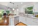 Modern kitchen featuring white cabinets, granite countertops, stainless steel appliances, and hardwood floors at 1438 Heritage Glen Dr, Marietta, GA 30068