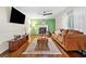Comfortable living room with fireplace, ceiling fan, hardwood floors and a serene ambiance at 1438 Heritage Glen Dr, Marietta, GA 30068