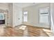 Sunlit bedroom with hardwood floors, white trim, closet, and natural light at 2179 William Way, Atlanta, GA 30345