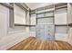 Spacious walk-in closet with custom shelving and hardwood floors at 2179 William Way, Atlanta, GA 30345