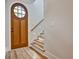Bright entryway features hardwood floors, a wooden door with glass, and stairs with built-in lighting at 2179 William Way, Atlanta, GA 30345