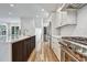 Gourmet kitchen with stainless appliances, white cabinets, and a center island at 2179 William Way, Atlanta, GA 30345