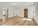 Primary bedroom with hardwood flooring, natural light, and ensuite bathroom with tub at 2179 William Way, Atlanta, GA 30345