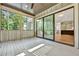Covered porch with sliding glass doors and view to the kitchen and stairs at 2179 William Way, Atlanta, GA 30345