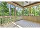 Screened-in porch with a view of the surrounding nature, offering a serene outdoor living space at 2179 William Way, Atlanta, GA 30345