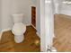 A minimalist bathroom design showcasing a toilet next to a built in shelving unit at 2555 Flat Shoals Rd # 3405, Atlanta, GA 30349