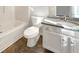 Bright bathroom with white cabinets, granite countertop, and a clean toilet design at 2555 Flat Shoals Rd # 3405, Atlanta, GA 30349