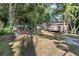Spacious backyard showcasing mature trees that offer a partially shaded area and room for recreation and enjoyment at 2935 Sawgrass Sw Trl, Lilburn, GA 30047