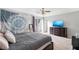 Spacious bedroom with a sliding glass door to a balcony, complete with a dresser and large bed at 2935 Sawgrass Sw Trl, Lilburn, GA 30047