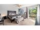 Bright bedroom with a large window, dresser, and comfortable bed, creating a welcoming and relaxing space at 2935 Sawgrass Sw Trl, Lilburn, GA 30047