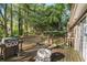 Deck featuring a grill and outdoor space overlooking a wooded area at 2935 Sawgrass Sw Trl, Lilburn, GA 30047
