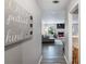 Inviting hallway with wood floors leading to a bright living room with a fireplace and comfortable seating at 2935 Sawgrass Sw Trl, Lilburn, GA 30047