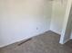 An empty bedroom with an open closet at 437 Saint Ives Sq, Stone Mountain, GA 30083