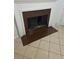 Fireplace set against tiled flooring. The bricked hearth provides additional seating at 437 Saint Ives Sq, Stone Mountain, GA 30083