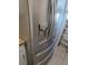 Stainless steel refrigerator with water and ice dispenser, complementing the kitchen's modern design at 437 Saint Ives Sq, Stone Mountain, GA 30083