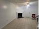 Living room with tile flooring, fireplace and ceiling fan with attached door at 437 Saint Ives Sq, Stone Mountain, GA 30083