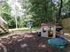 Spacious backyard with playhouse and swing set at 49 Brinkley Ct, Dallas, GA 30157