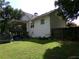 Well-maintained lawn, partially fenced backyard, and deck on house at 49 Brinkley Ct, Dallas, GA 30157