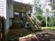 Backyard showing deck with stairs and grassy area at 49 Brinkley Ct, Dallas, GA 30157