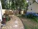 Landscaped backyard with stepping stones and a privacy fence at 49 Brinkley Ct, Dallas, GA 30157