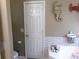 Bathroom features a white door, tiled backsplash, and themed decor, creating a relaxing atmosphere at 49 Brinkley Ct, Dallas, GA 30157