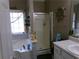 Bright bathroom with a tub, glass shower, and nautical themed decor at 49 Brinkley Ct, Dallas, GA 30157