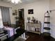Elegant dining room with wood floors, stylish furniture, and soft lighting creating a warm atmosphere at 49 Brinkley Ct, Dallas, GA 30157