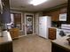 Spacious kitchen featuring ample cabinetry, modern appliances, tile flooring and an eat-in dining area at 49 Brinkley Ct, Dallas, GA 30157