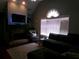 Comfortable living room with a fireplace, dark gray sofa and a view to the window and natural light at 49 Brinkley Ct, Dallas, GA 30157