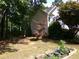 View of backyard showing vegetable garden at 49 Brinkley Ct, Dallas, GA 30157