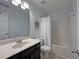 Bathroom with vanity, toilet and shower with blue walls at 440 Berckman Nw Dr, Lilburn, GA 30047