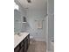 Bathroom features a double vanity sink, a toilet, and shower with neutral wall color at 440 Berckman Nw Dr, Lilburn, GA 30047