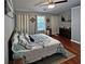 Spacious primary bedroom with vaulted ceiling, hardwood floors, and decorative accents at 440 Berckman Nw Dr, Lilburn, GA 30047