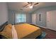 Bedroom featuring hardwood floors, a ceiling fan, closet, and neutral paint at 440 Berckman Nw Dr, Lilburn, GA 30047