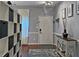 Well-lit entryway featuring hardwood floors, custom storage, and a welcoming atmosphere at 440 Berckman Nw Dr, Lilburn, GA 30047