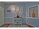 Charming foyer with hardwood floors, a decorative table, and tasteful wall art creating a warm welcome at 440 Berckman Nw Dr, Lilburn, GA 30047