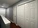 Second floor hallway featuring hardwood floors and closet and bedroom door access at 440 Berckman Nw Dr, Lilburn, GA 30047