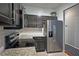 Well-lit kitchen featuring stainless steel fridge, granite countertops and subway tile backsplash at 440 Berckman Nw Dr, Lilburn, GA 30047