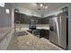 Modern kitchen with granite countertops, stainless appliances, and tile backsplash at 440 Berckman Nw Dr, Lilburn, GA 30047