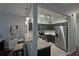 Open-concept kitchen with stainless steel appliances and breakfast bar seating at 440 Berckman Nw Dr, Lilburn, GA 30047