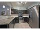 Contemporary kitchen with stainless steel appliances and granite countertops at 440 Berckman Nw Dr, Lilburn, GA 30047