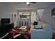 Cozy living room featuring modern decor, ceiling fan, and open access to the kitchen and stairway at 440 Berckman Nw Dr, Lilburn, GA 30047