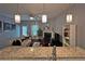 Open concept living area with granite countertop and view of fireplace, couch and entertainment center at 440 Berckman Nw Dr, Lilburn, GA 30047