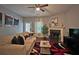 Bright living room with modern fireplace, comfortable seating, and stylish decor at 440 Berckman Nw Dr, Lilburn, GA 30047
