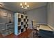 Well-lit office space with hardwood floors, storage shelving, and neutral colors at 440 Berckman Nw Dr, Lilburn, GA 30047